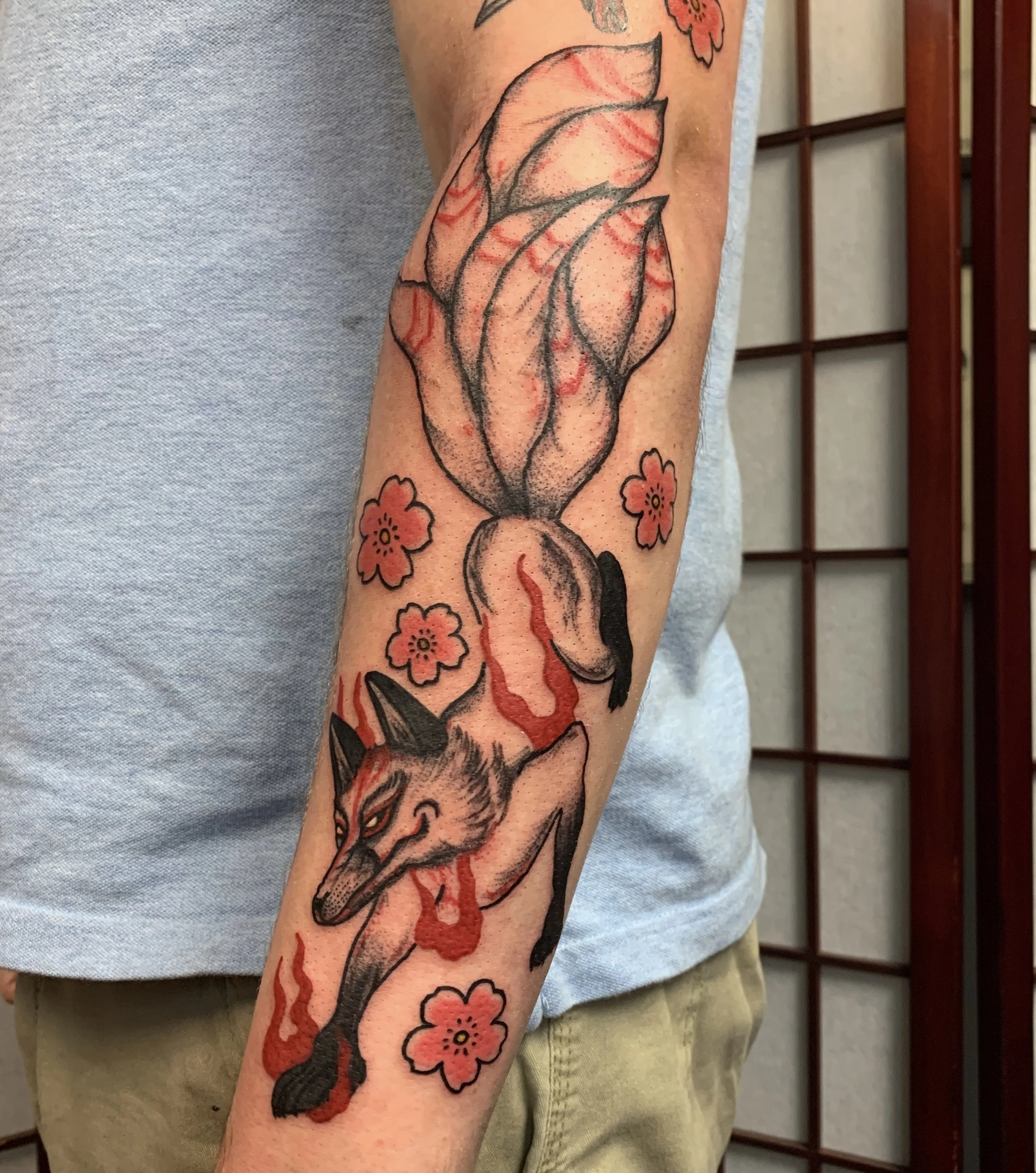 Japanese Kitsune fox arm sleeve tattoo done in color.
