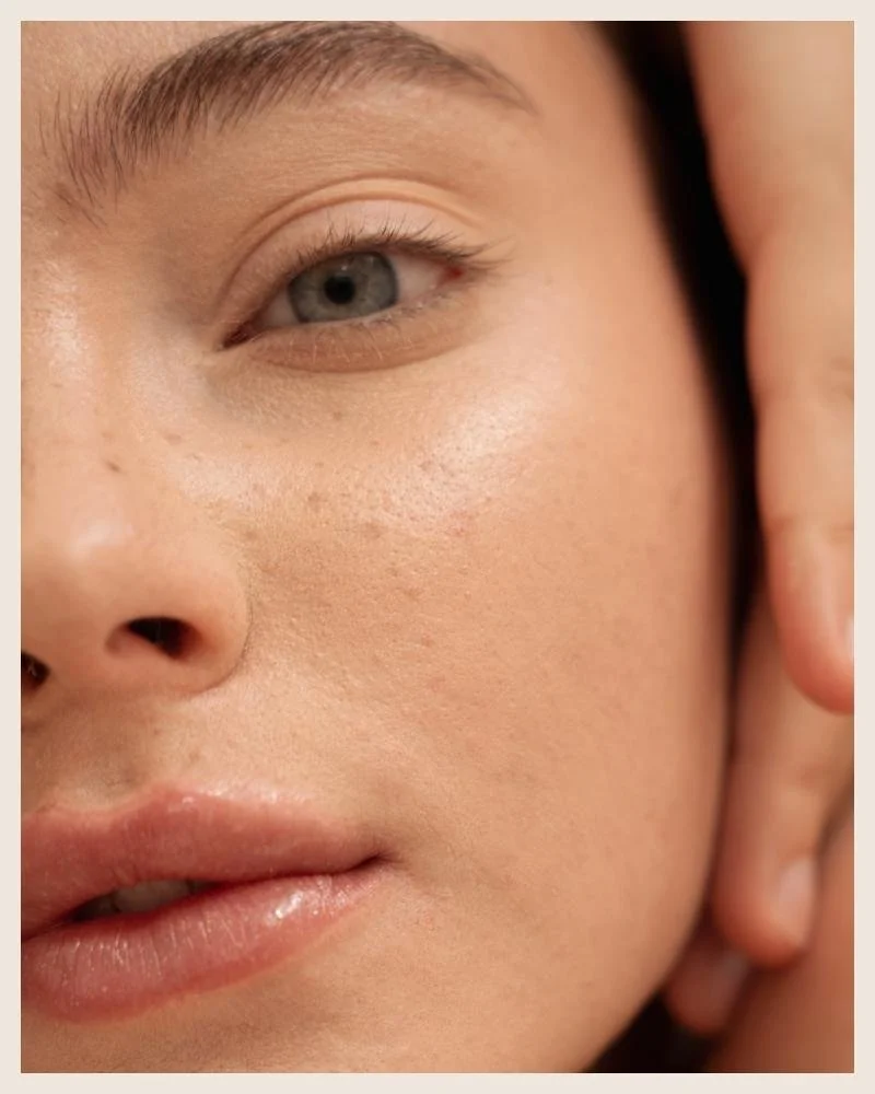 Close-up of a person's face showing clear skin, eye, nose, and lips.