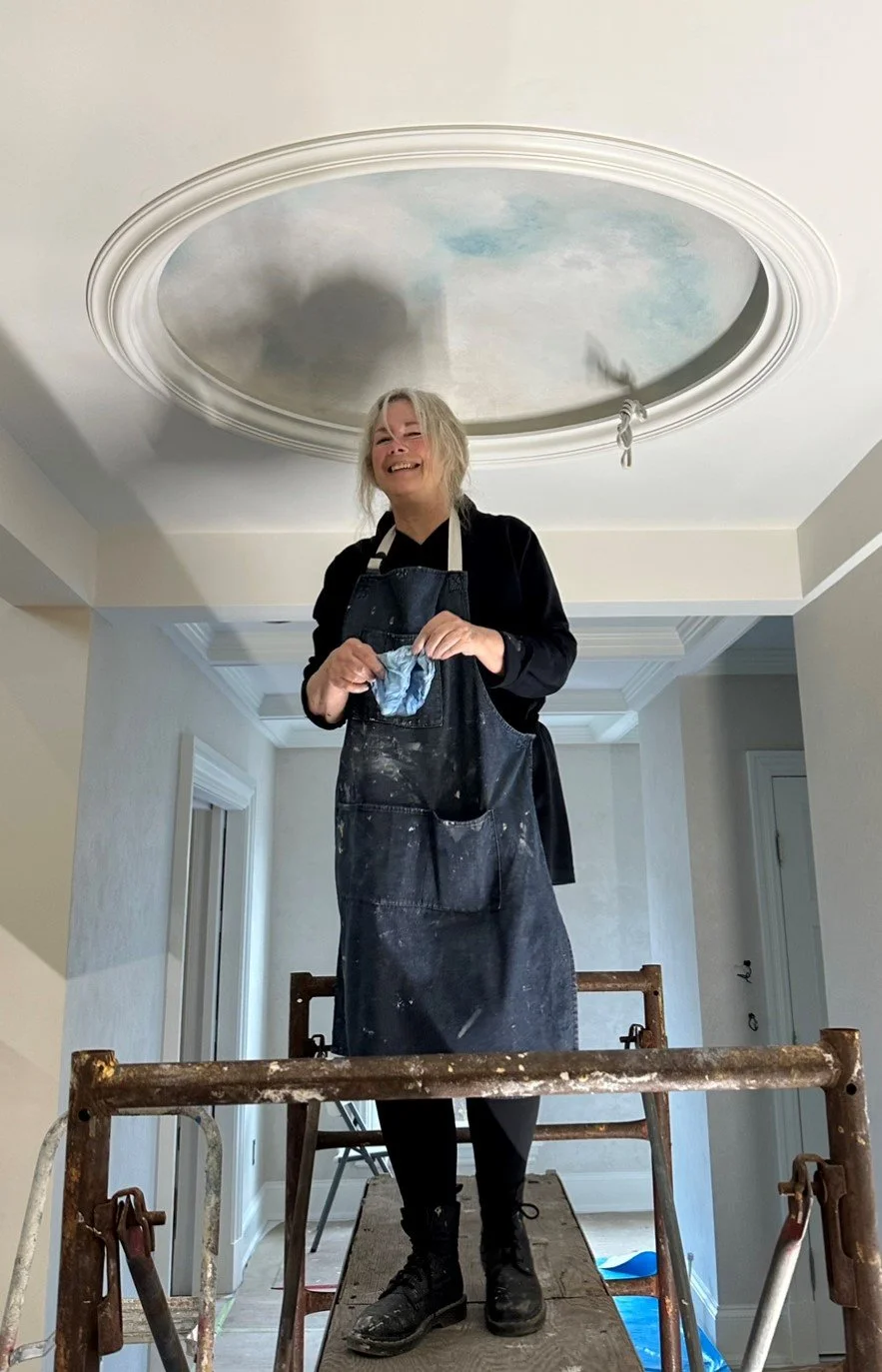 Photo of heather paining a ceiling sky