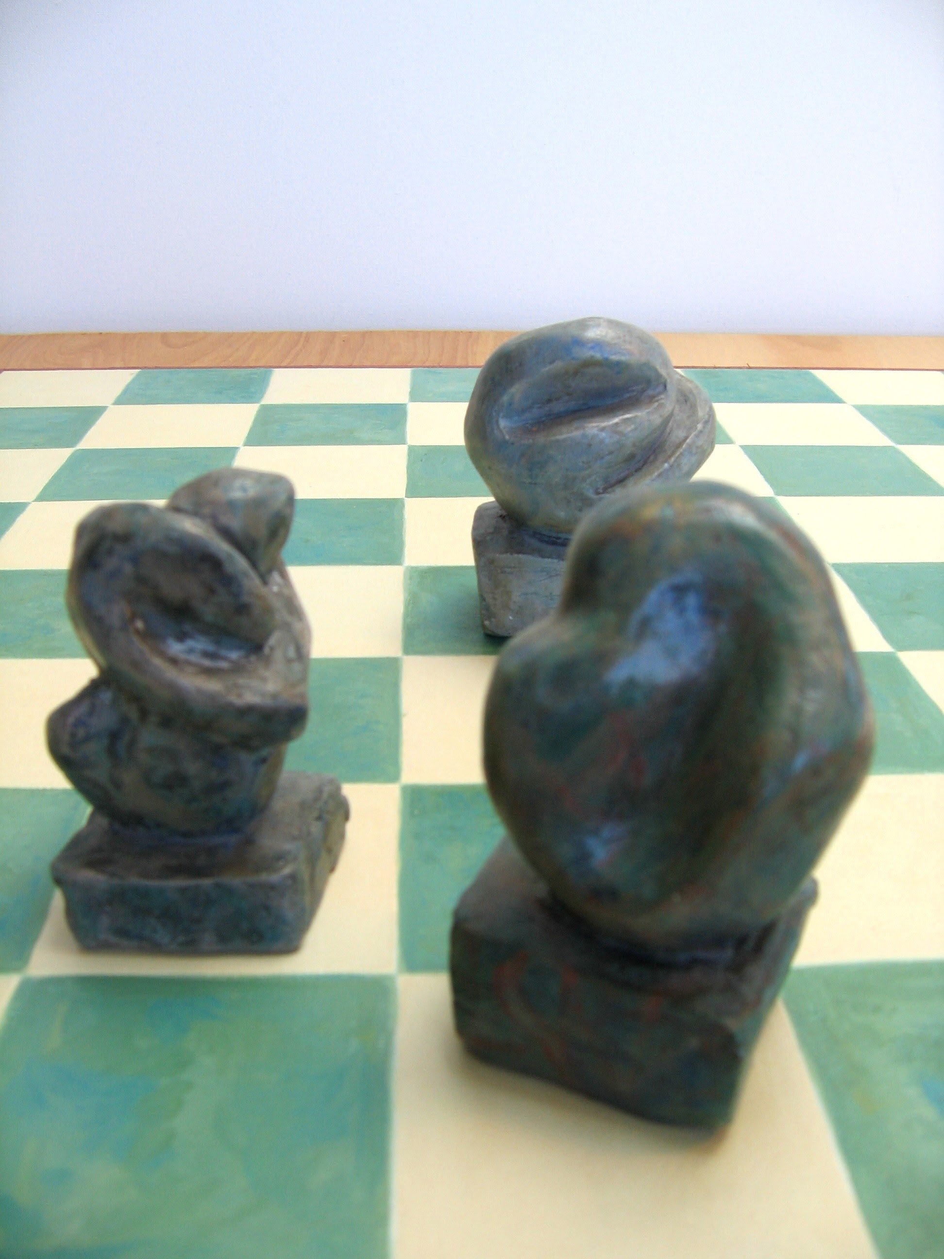 Checkerboard Sculptures (1995) View 7, Clay w/Patina (Range in size 3"-5")