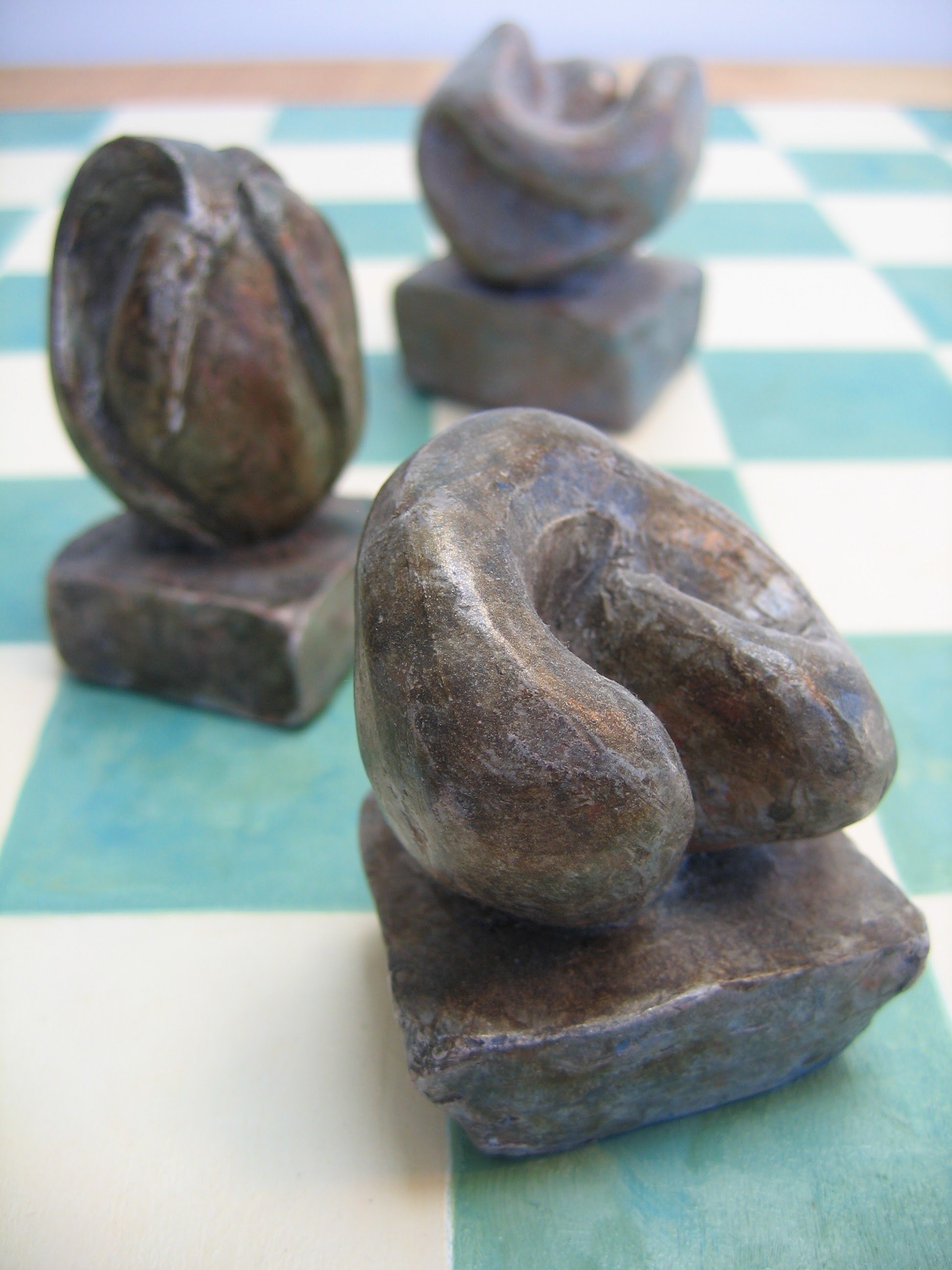 Checkerboard Sculptures (1995) View 3, Clay w/Patina (Range in size 3"- 5")