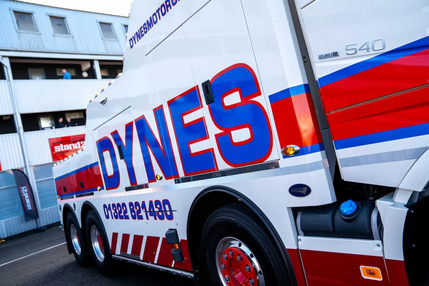 Dynes Motor Group heavy recovery truck with branded logo and phone number