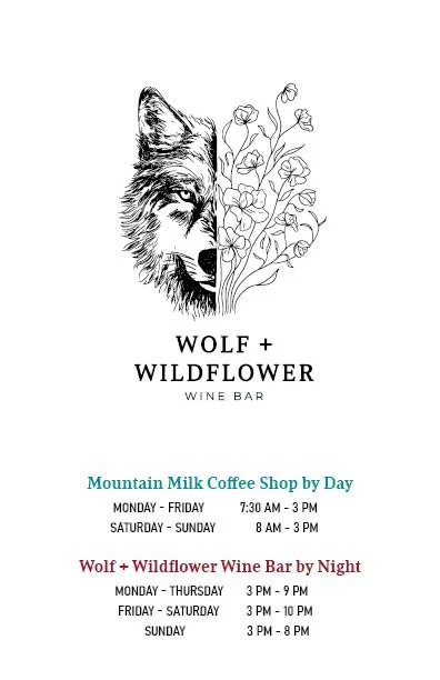 A black and white illustration of a wolf's face combined with a cluster of wildflowers. The text reads "Wolf + Wildflower Wine Bar" and provides hours for Mountain Milk Coffee Shop by Day and Wolf + Wildflower Wine Bar by Night.