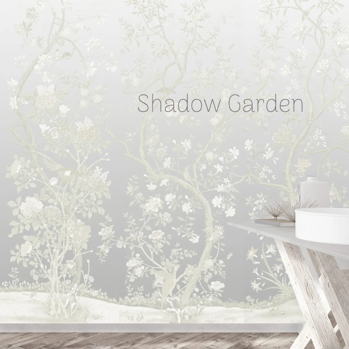 Shadow Garden. Our beautiful interpretation of the Abernant design created on mica to enhance and lift the design from the wall. 
With its ghostly image the paper in soft pastel shades now sparkles when it catches the light with how the mica reacts t