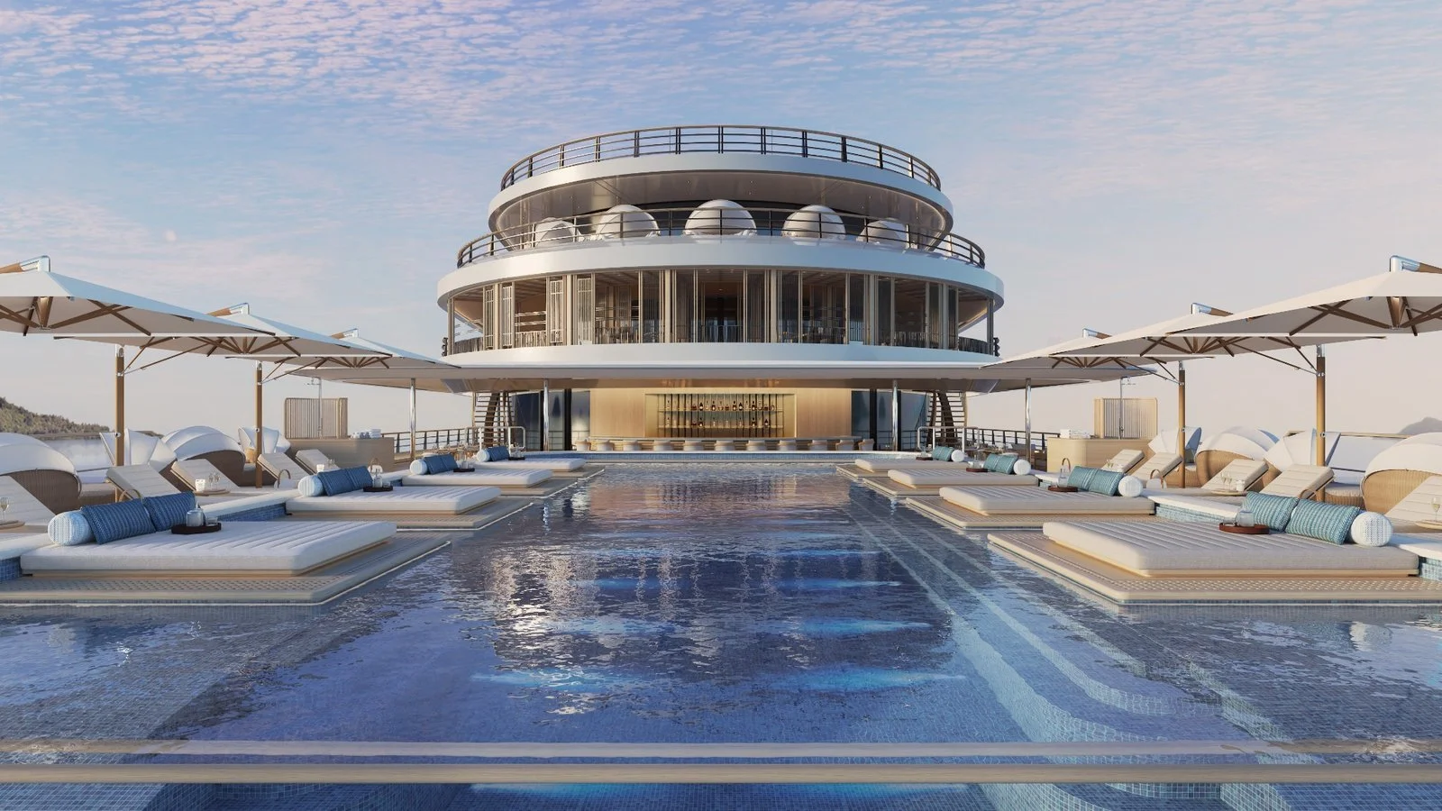 Amangati by Aman luxury yacht pool deck with sun loungers and umbrellas, part of the Aman at Sea vessel launching in 2027.