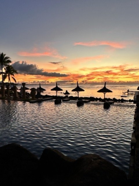 The_Oberoi_Mauritius_Pool_Sunset.jpeg