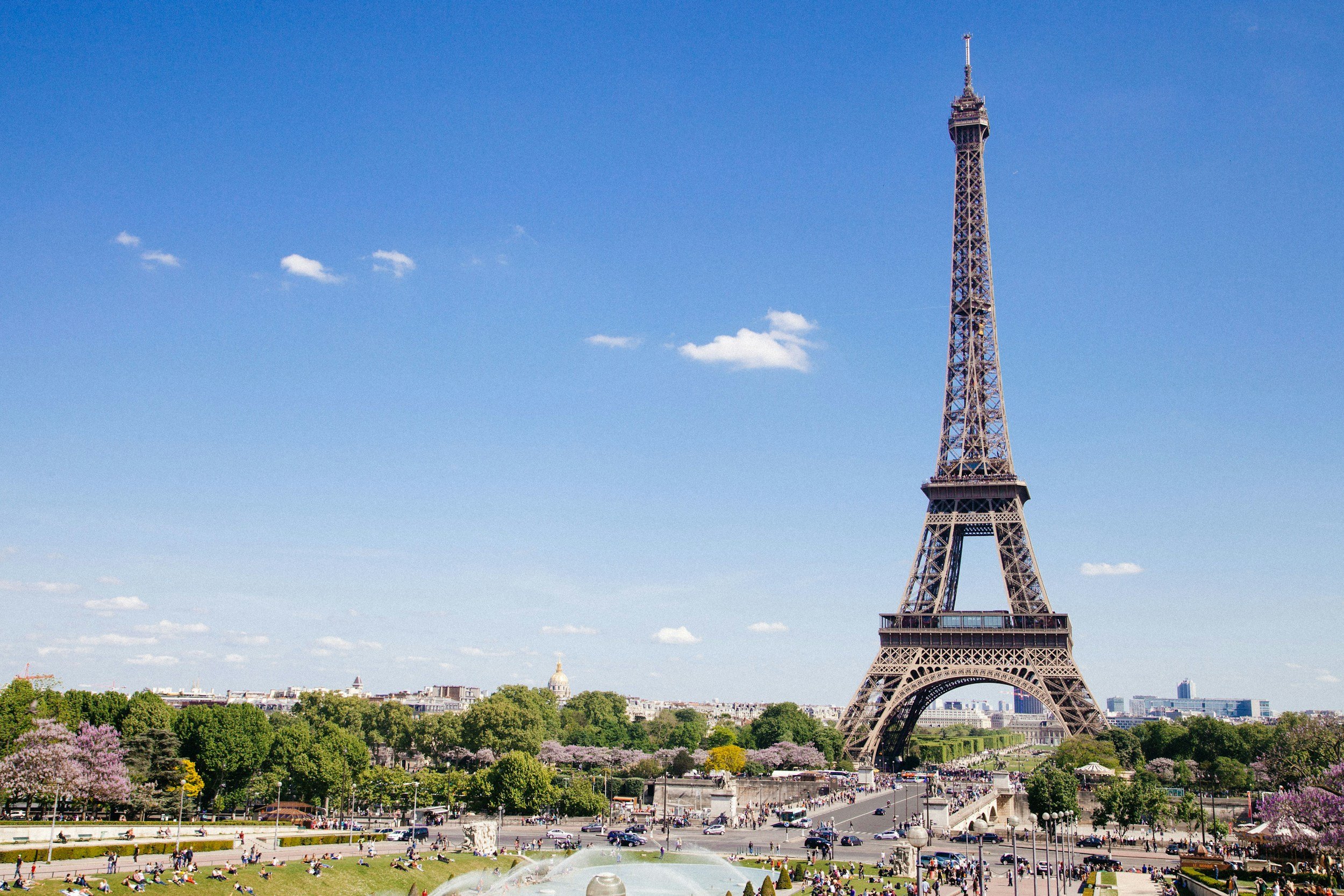 Eiffel tower in Paris with blue sky behind