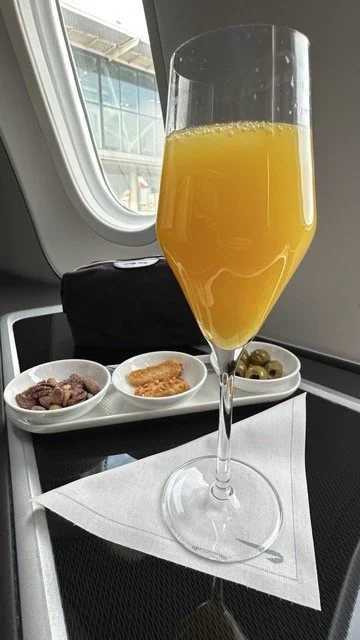 british-airways-first-class-bucks-fizz-and-snacks-boeing-787.jpeg