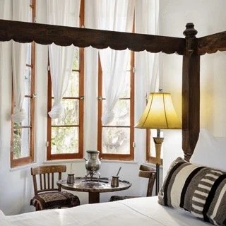 korakia-pensione-four-poster-bed-cozy-nook.jpeg