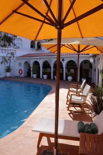 mount-cinnamon-poolside-seating-under-orange-umbrellas.jpeg