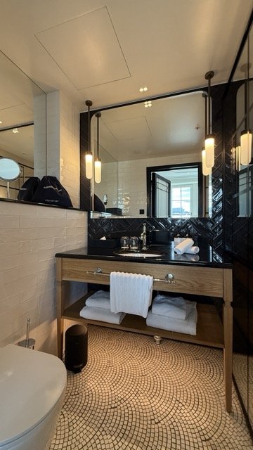vanity-station-wood-marble-black-tiles.jpeg