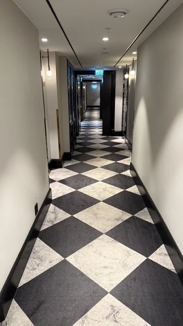 amerikalinjen-hotel-oslo-checkered-hallway.jpeg
