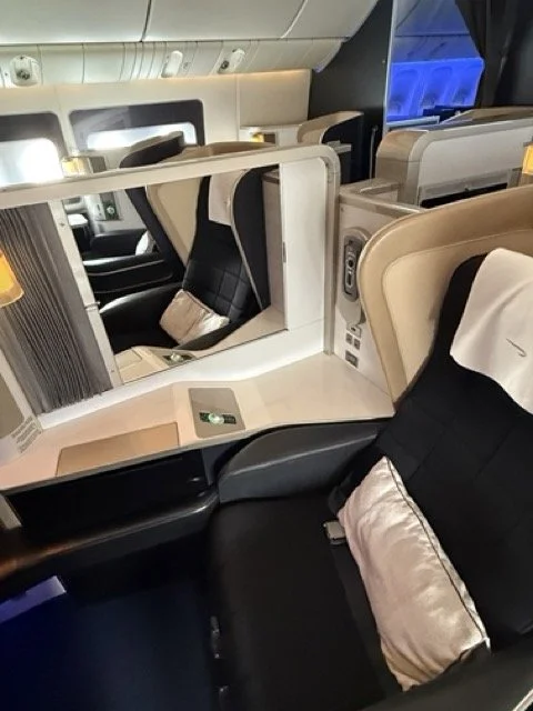 british-airways-first-class-seat-with-pillow-and-mirror.jpeg