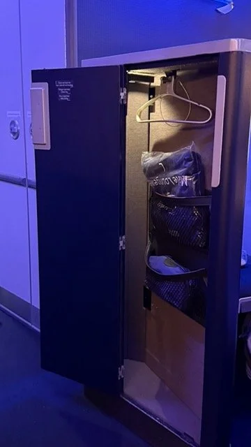 ba-first-class-seat-locker-loungewear-storage.jpeg