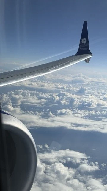 icelandair-wing-view-above-clouds.jpeg