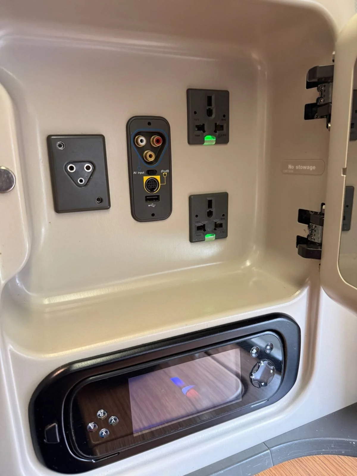 american-airlines-first-class-power-ports-storage-compartment.jpg