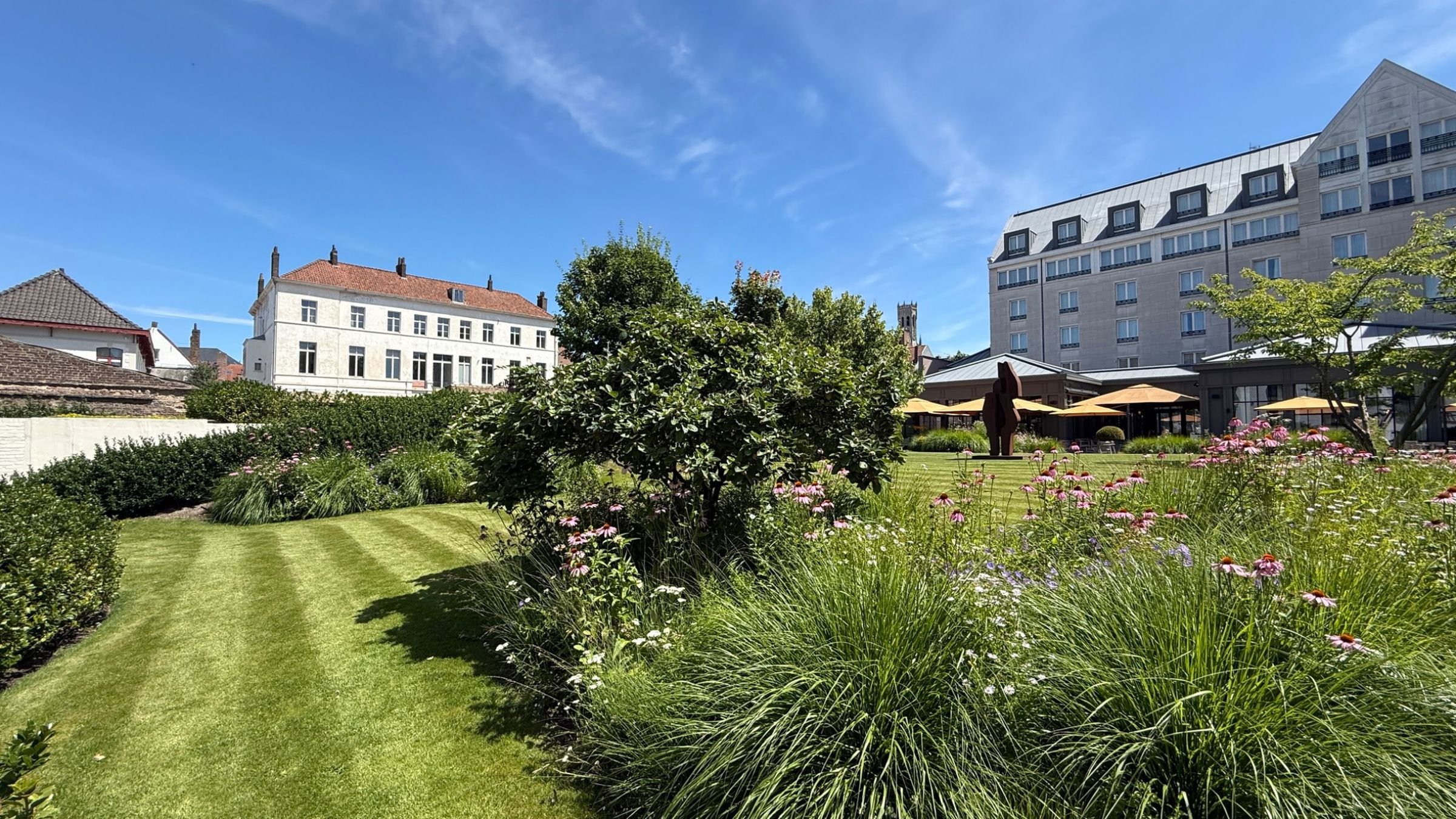 Landscaped gardens with colourful planting at Duke's Palace Bruges, Belgium.