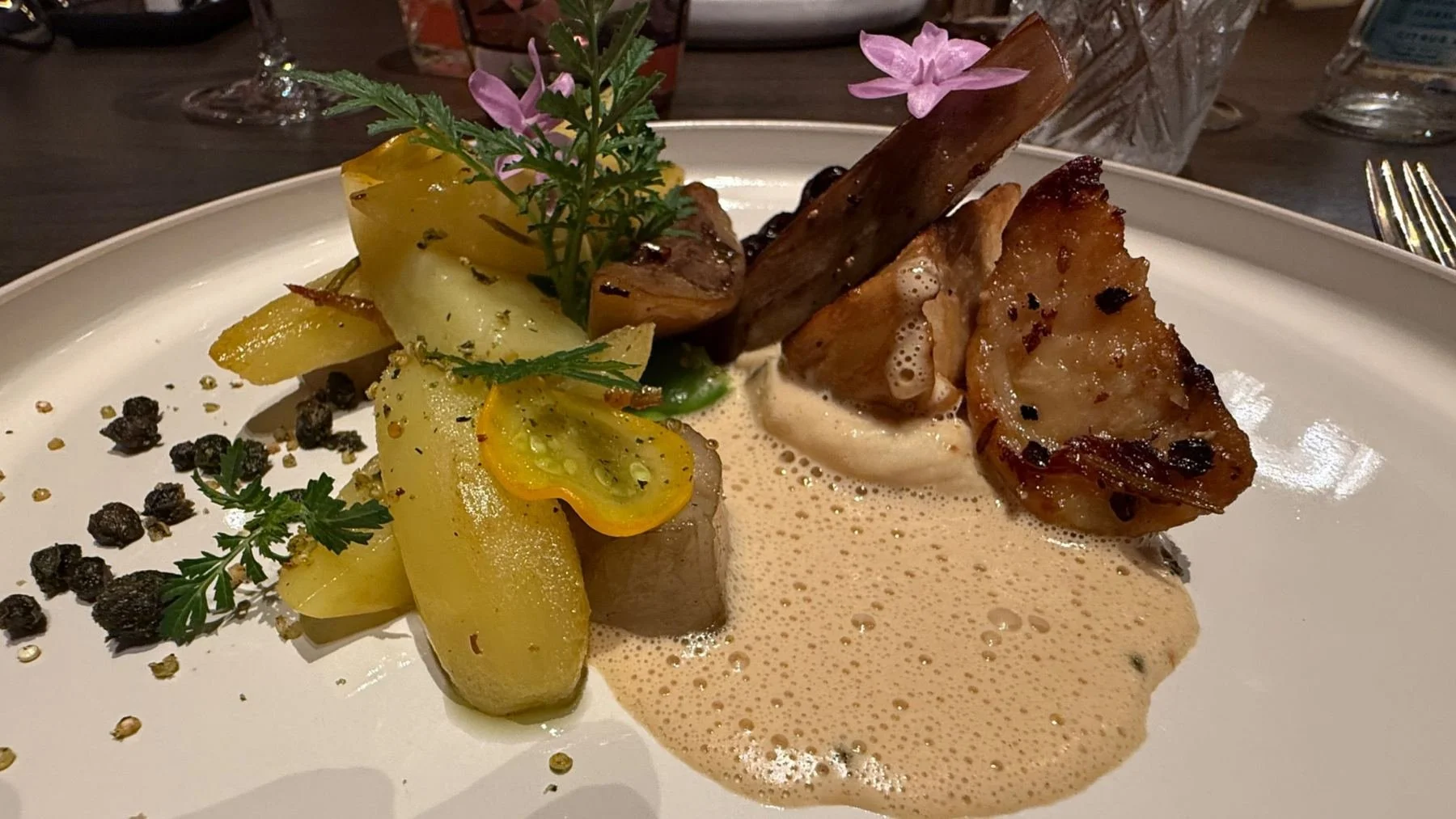 Beautifully presented main course served at Reliva restaurant in Bruges, showcasing seasonal local ingredients and contemporary Belgian cuisine.