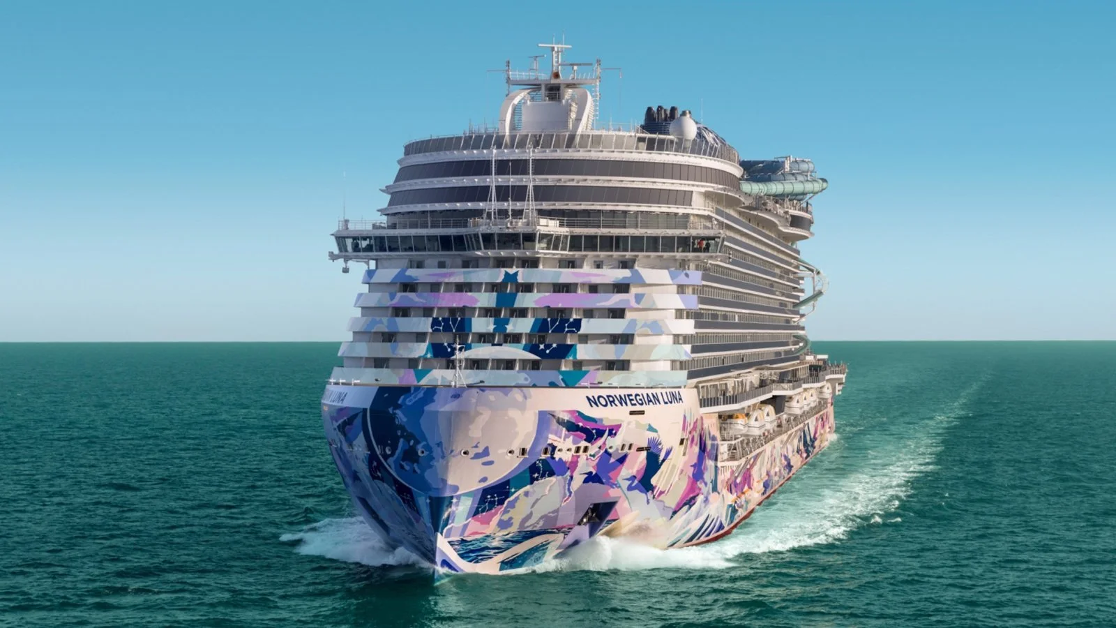Norwegian Luna cruise ship sailing at sea with colourful hull artwork and open ocean views