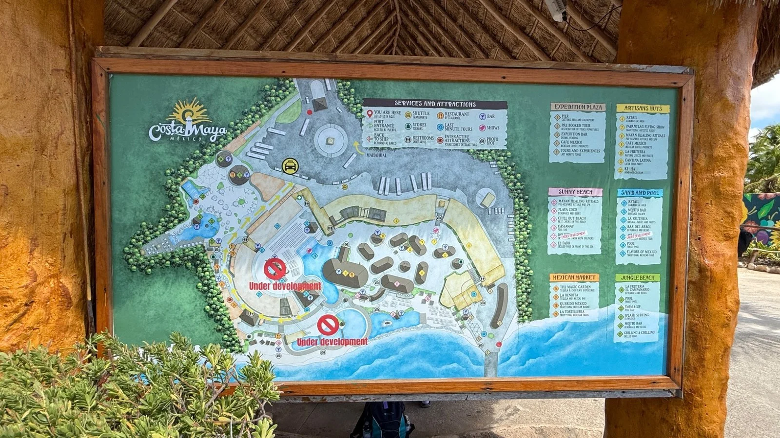 Shops and restaurants at Costa Maya cruise port with vibrant buildings and visitor area in Mexico