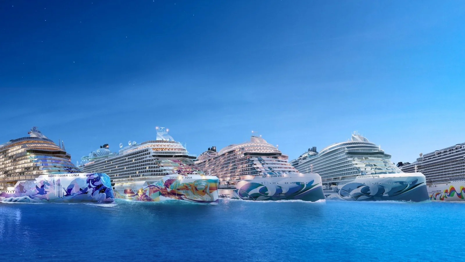 Aerial view of Norwegian Cruise Line ships including Norwegian Luna, Viva and Prima lined up at sea