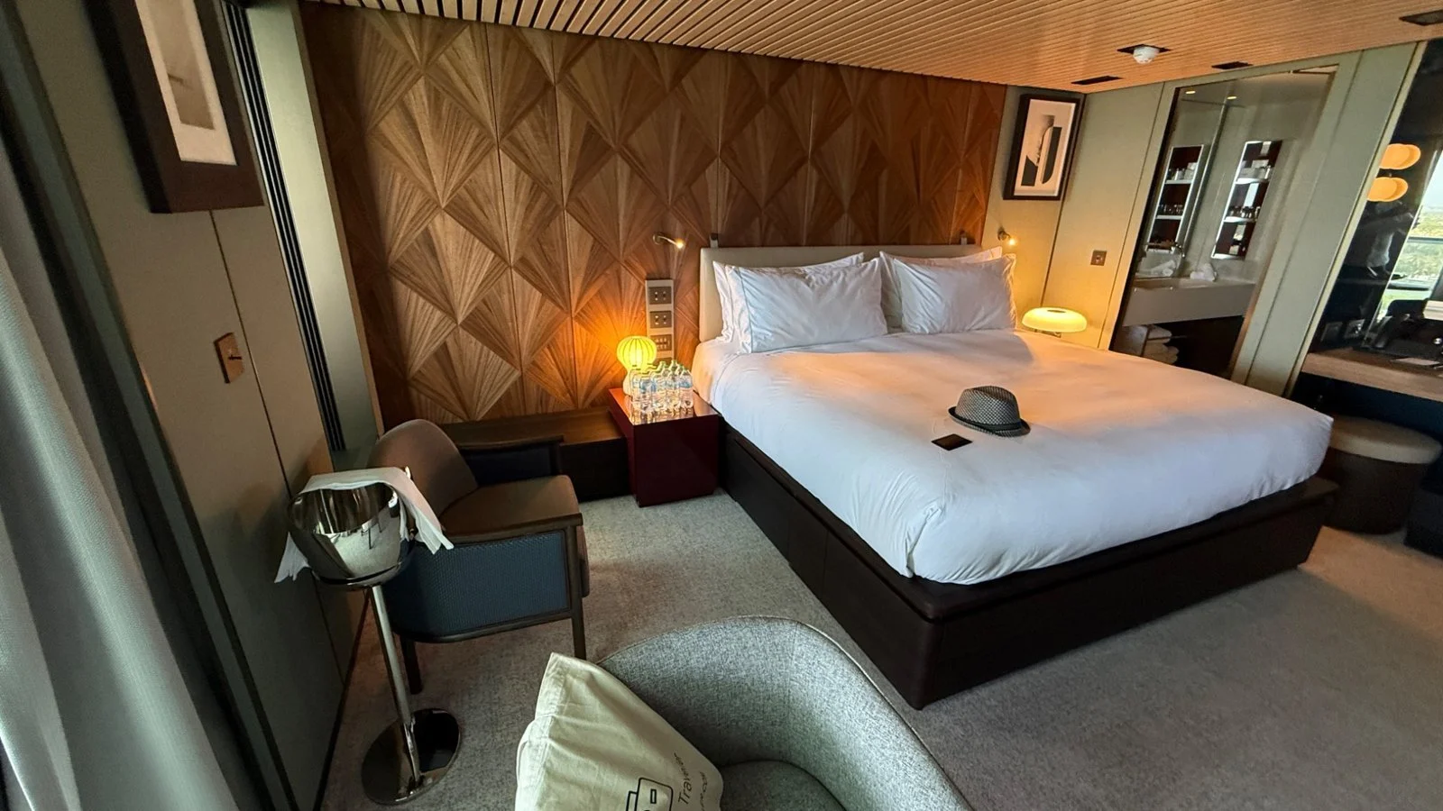 The Haven suite bedroom on Norwegian Luna with king bed and modern interior design
