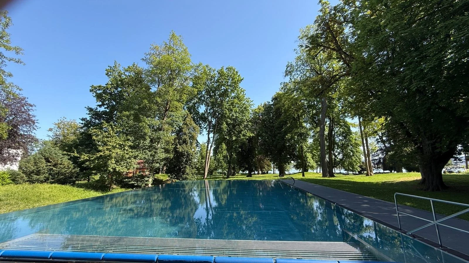 Outdoor swimming pool in the landscaped gardens at BUFF Medical Resort on Lake Constance, Germany.