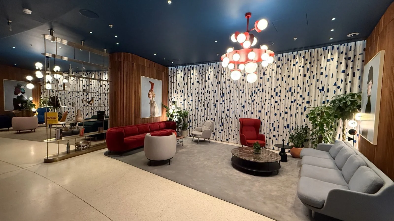 Contemporary lobby lounge at art’otel London Battersea Power Station featuring modern furniture, artwork and ambient lighting