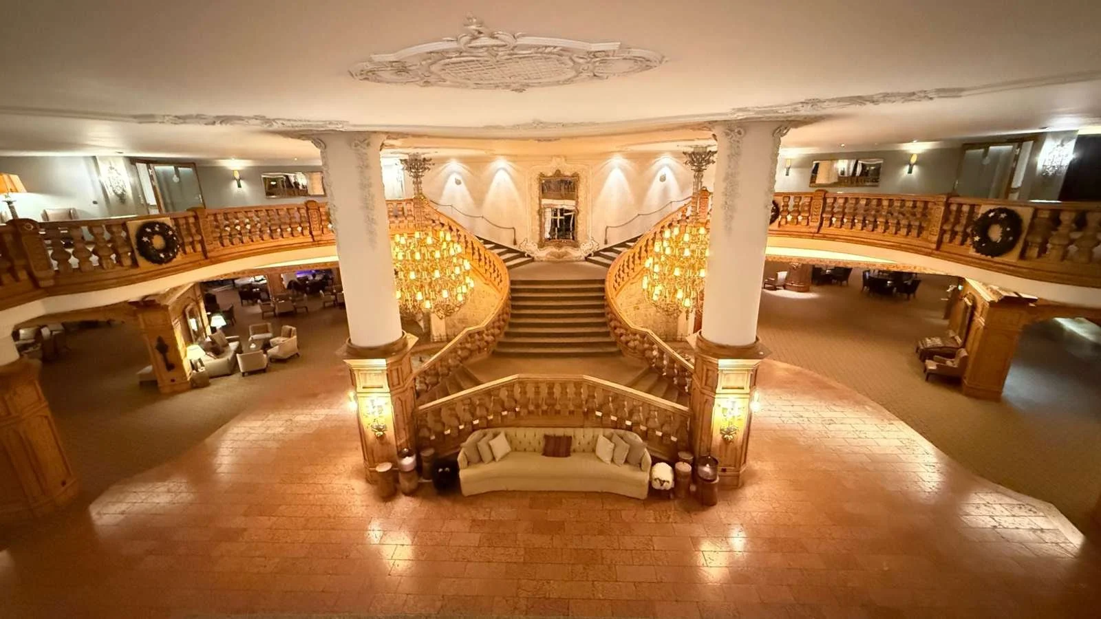 Grand staircase and chandelier in the main lobby at Interalpen-Hotel Tyrol