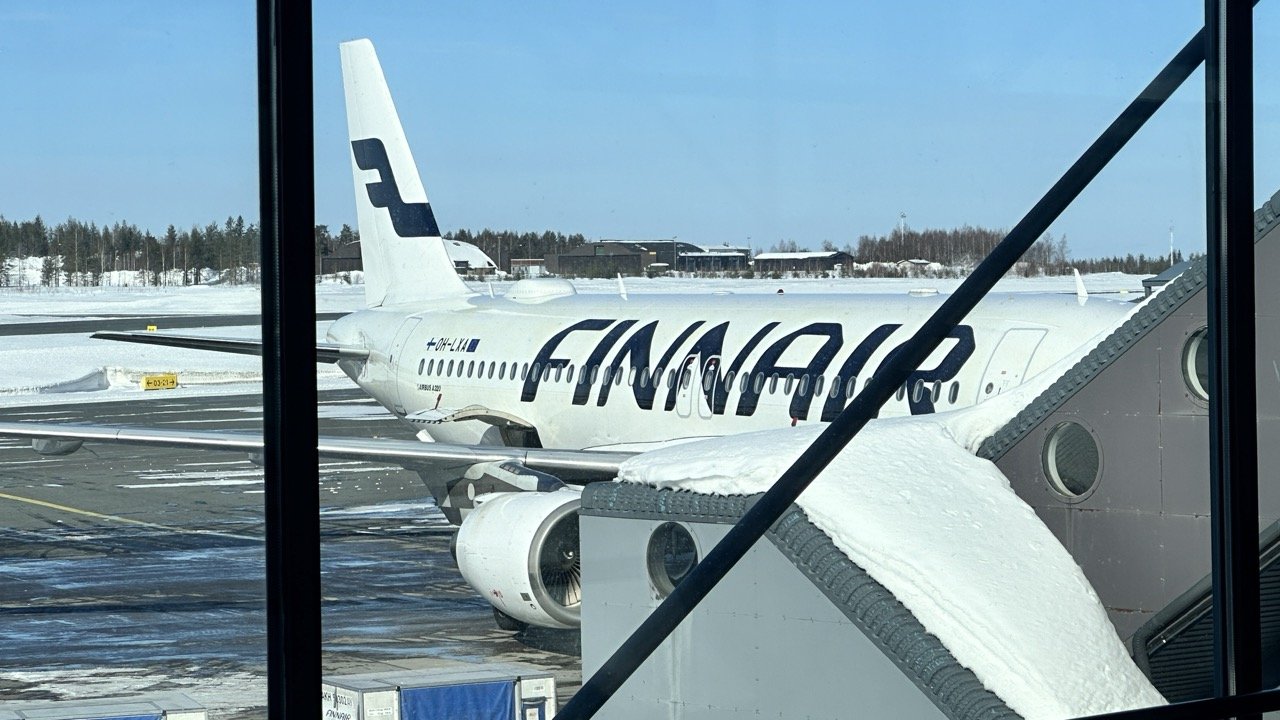 Finnair plane through windows at Rovaniemi Airport Lapland