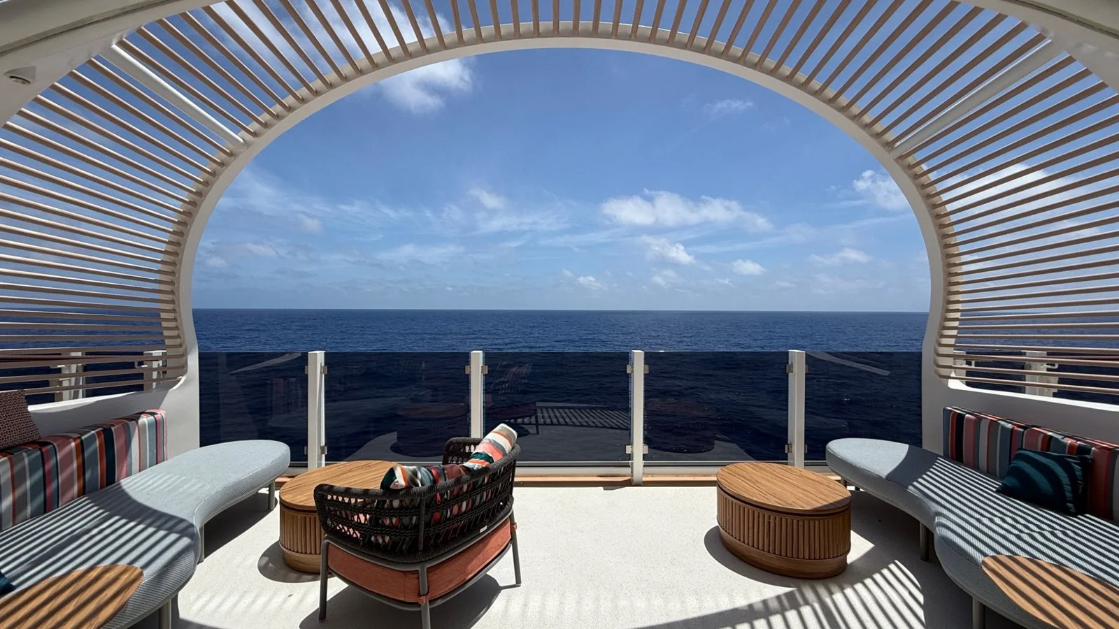 Outdoor terrace in The Haven on Norwegian Luna with panoramic ocean views at sea
