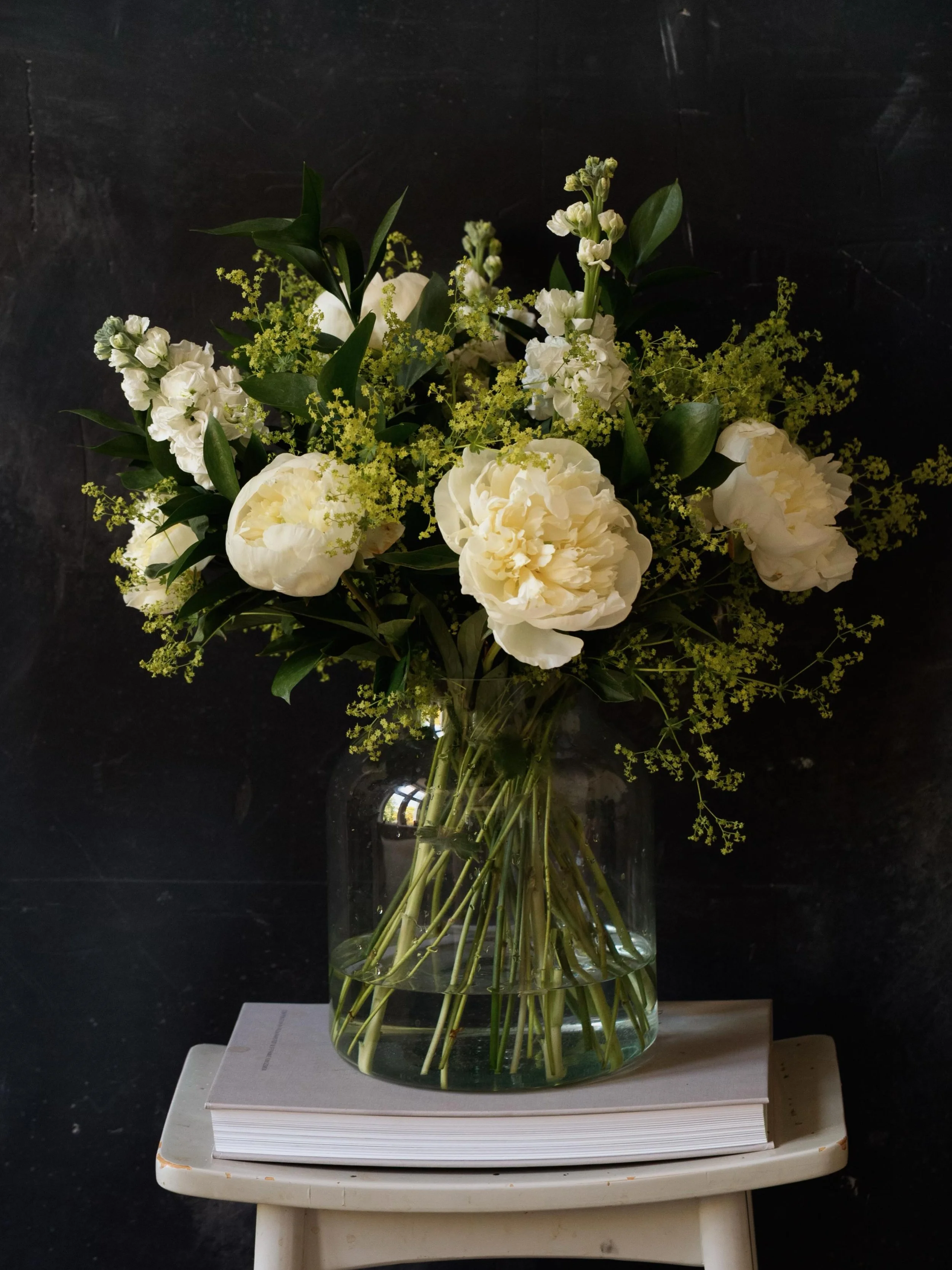 The white peony is almost as though light itself is blooming. Her petals diffuse light softly and form becomes less defined; her beauty feels less performative and more atmospheric.

Many people unconsciously respond to white peonies as cleansing, me