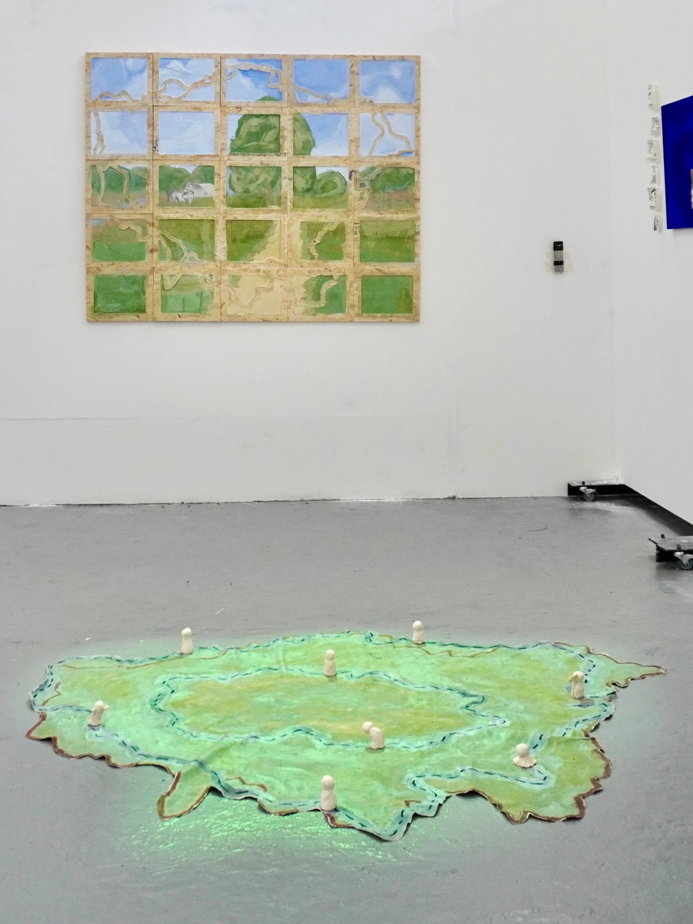 &lsquo;Around the Loop in 7 Months&rsquo;, Made By Kulsoma, 2026: (A) Fresco on OSB (153x123cm), 25 piece polyptich;(B) acrylic and oil on canvas playmat with plasticine figures and animation of fishes on top, (170x130cm), unstretched floor installat