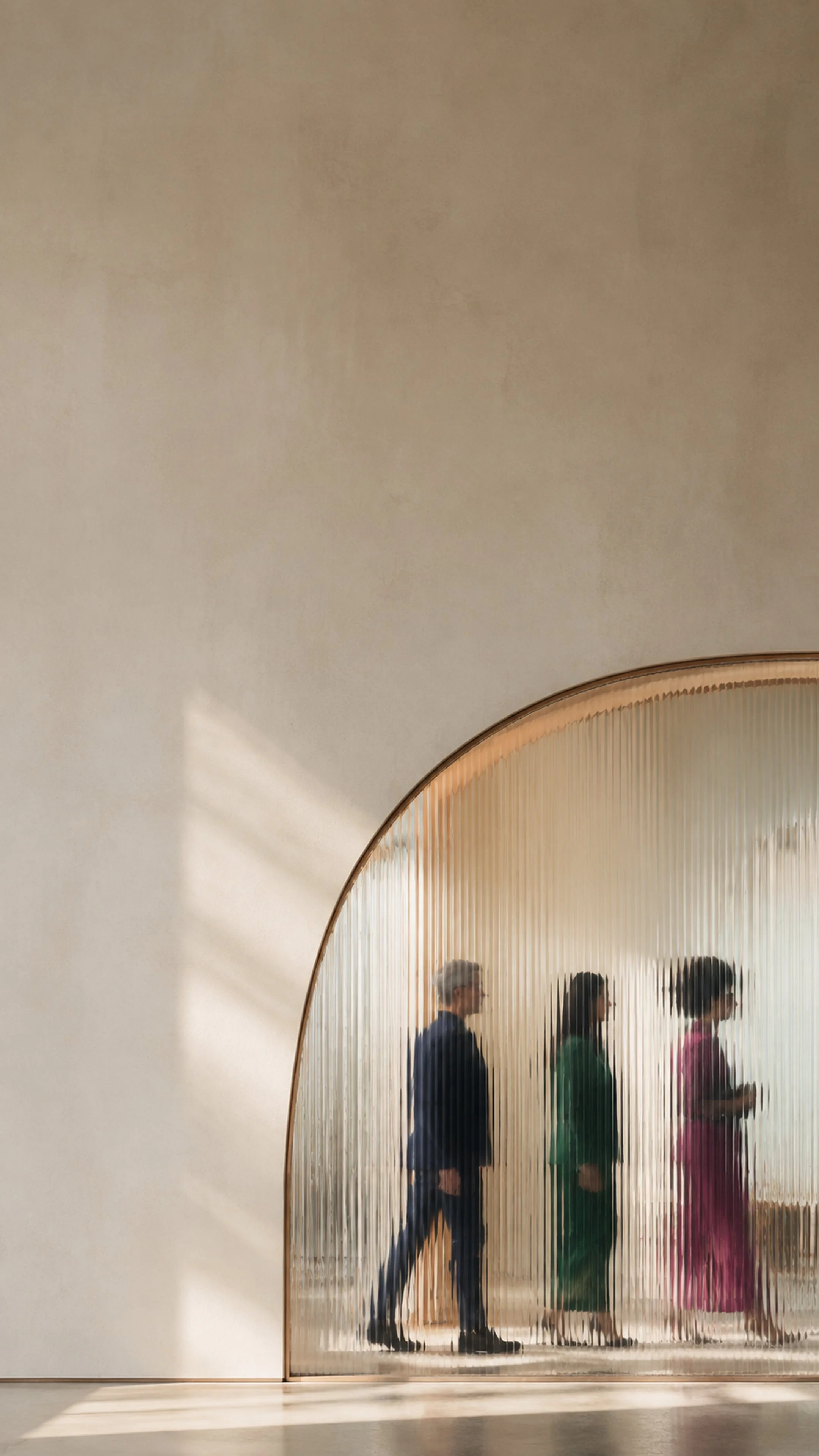 People walking past a textured glass wall with a large arched opening.