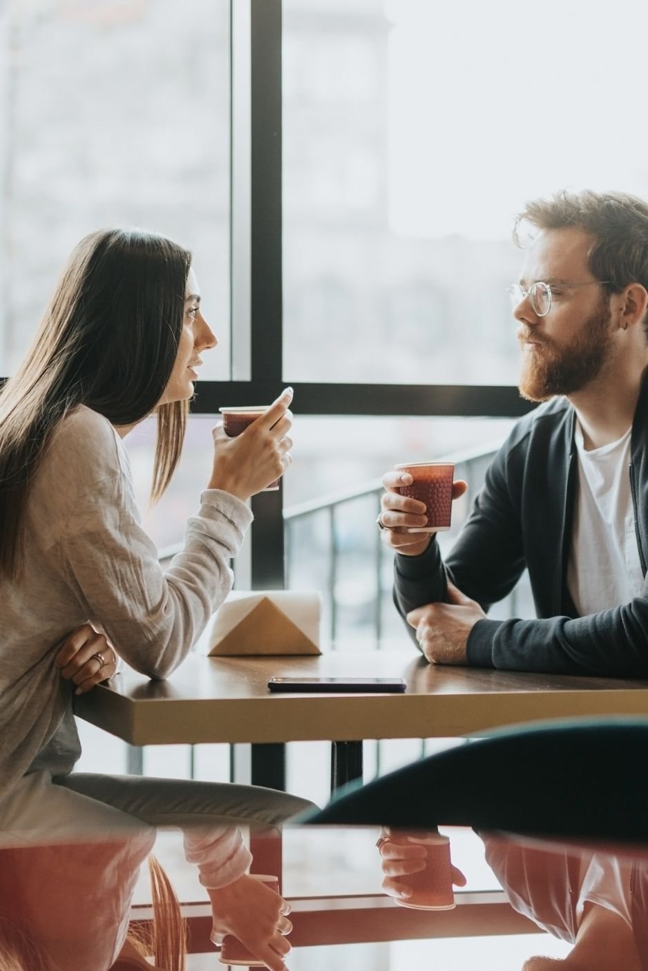 Couple having a conversation at a cafe