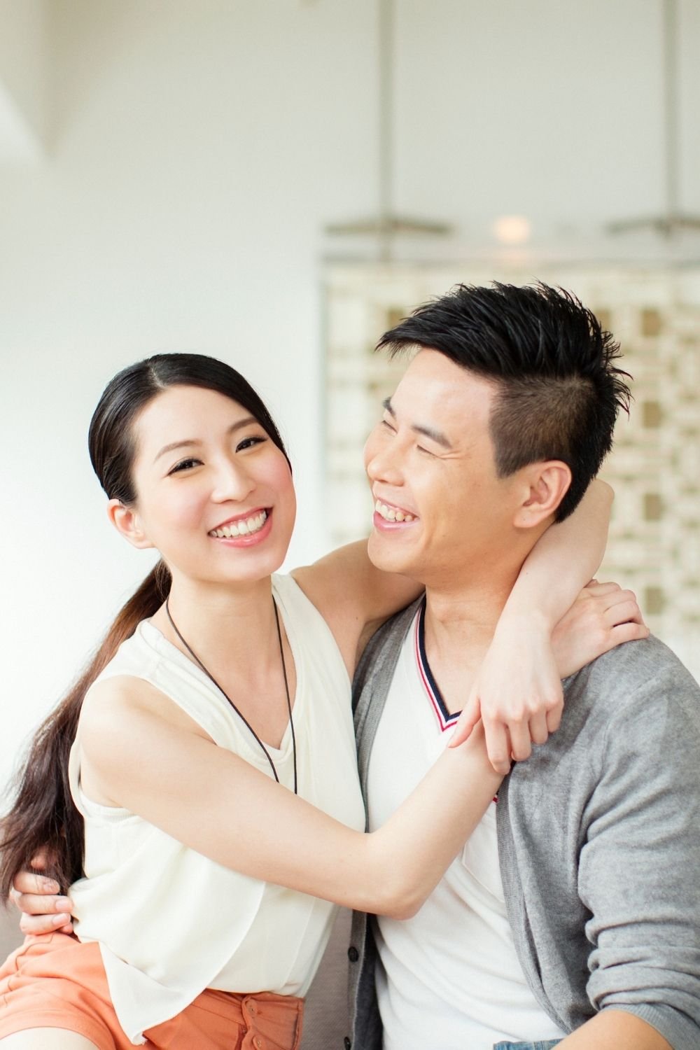 Young couple embracing each other smiling