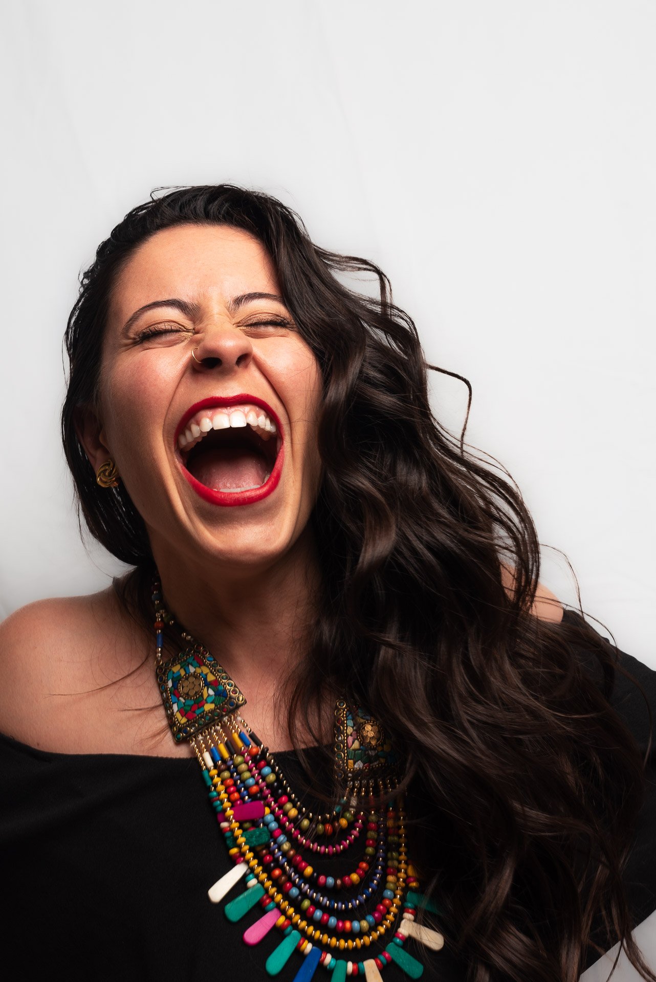 Woman with eyes closed shouts in excitement