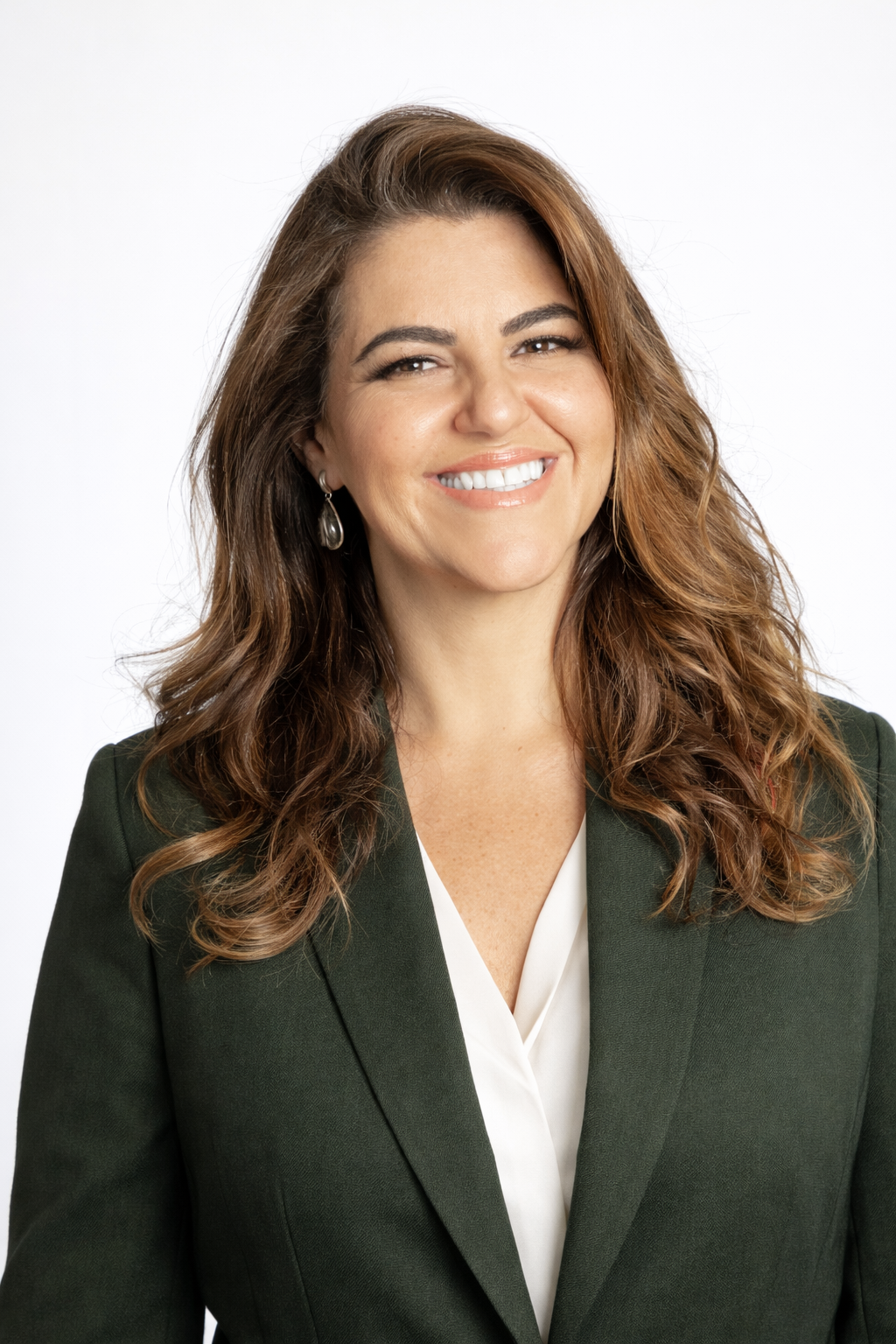 Woman holding black kettlebells, smiling, wearing a bright yellow tank top with blue text and a logo, standing against a white background.