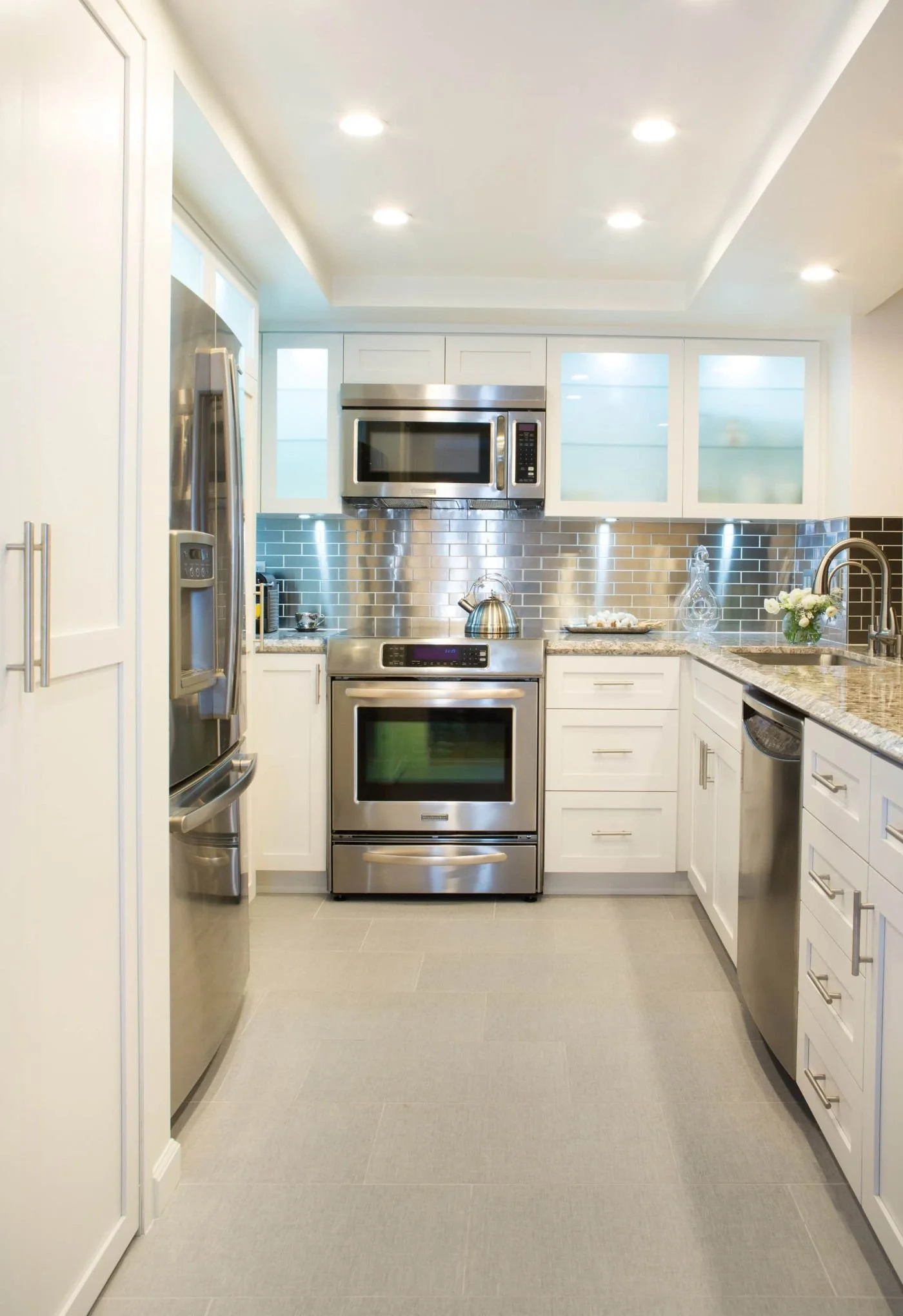 White Shaker Kitchen with Stackable Washer & Dryer - Wilshire Corridor