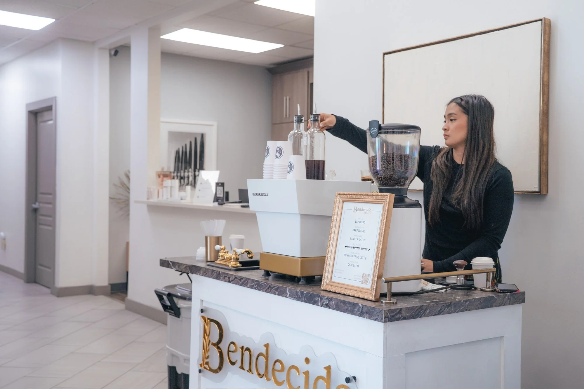 Barista preparing espresso at the Bendecido Coffee cart in a suburban office near Carrollwood, Tampa