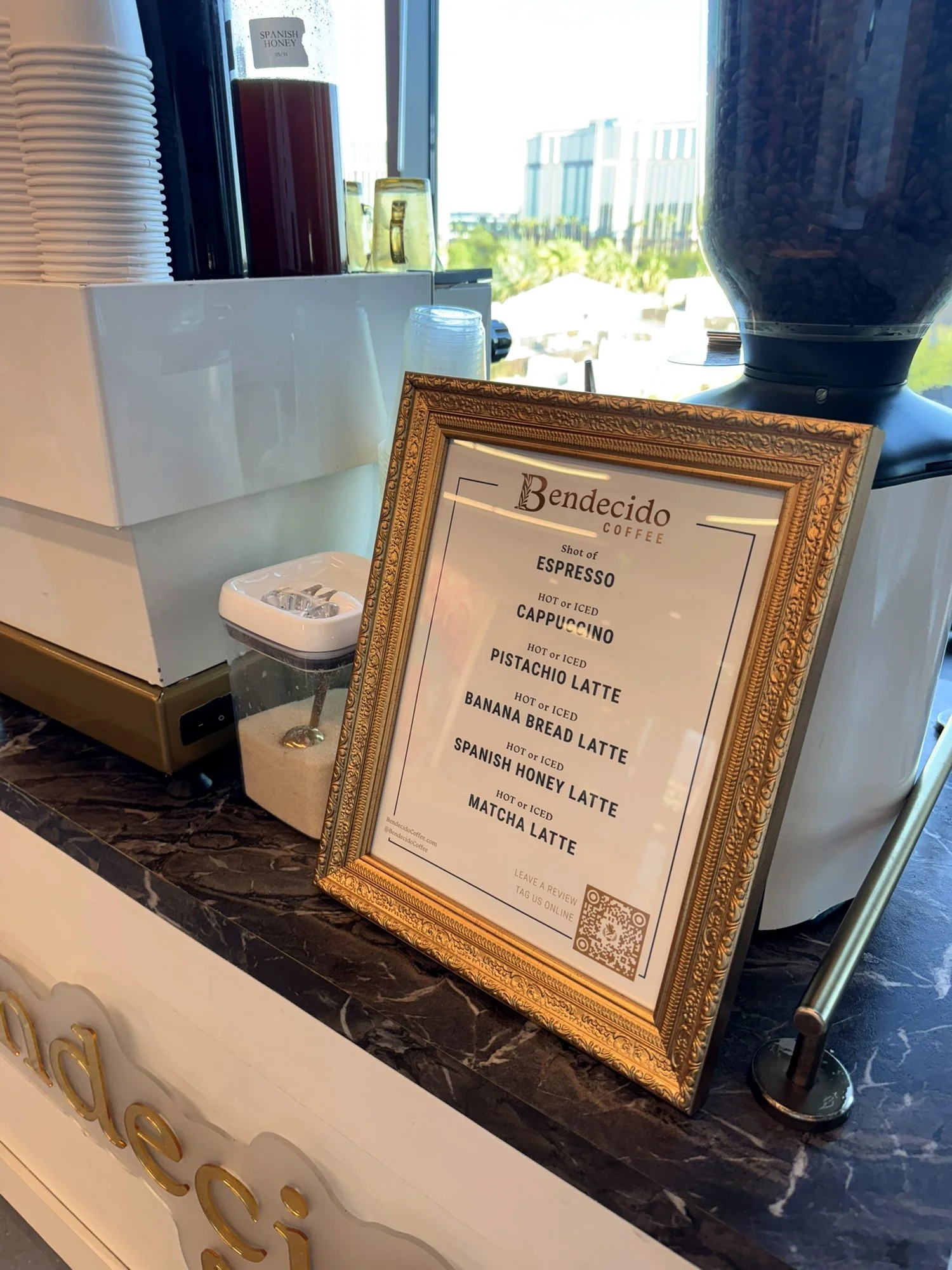 Bendecido Coffee menu on the espresso cart with a Westshore Tampa skyline view