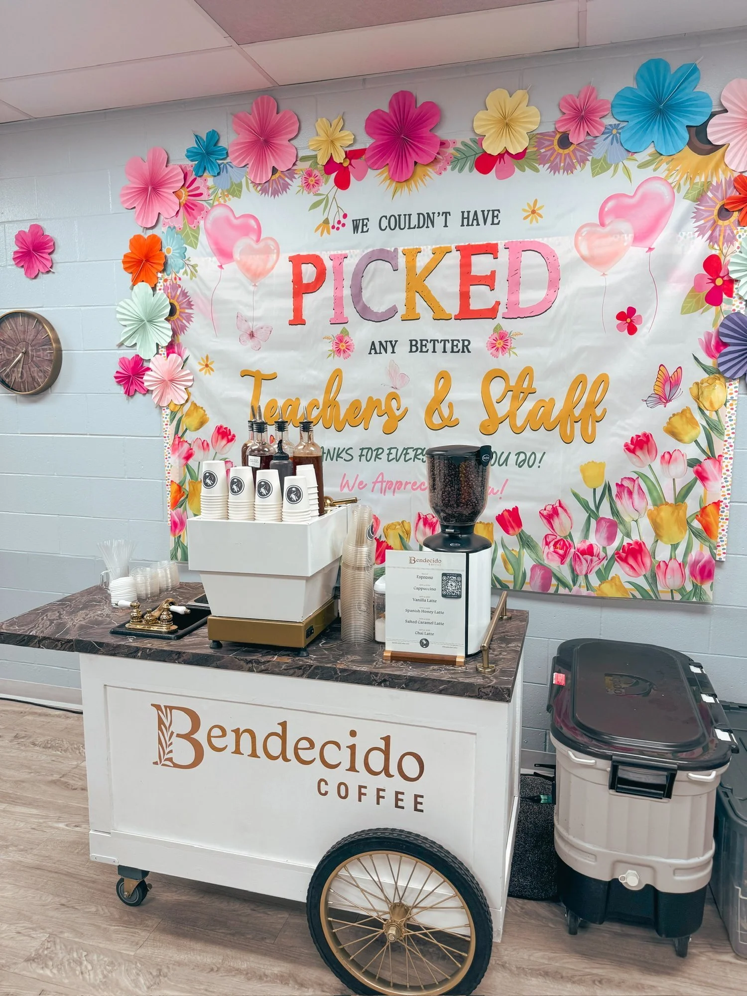 Bendecido Coffee cart in front of a floral Teacher and Staff Appreciation banner at a Tampa Bay school