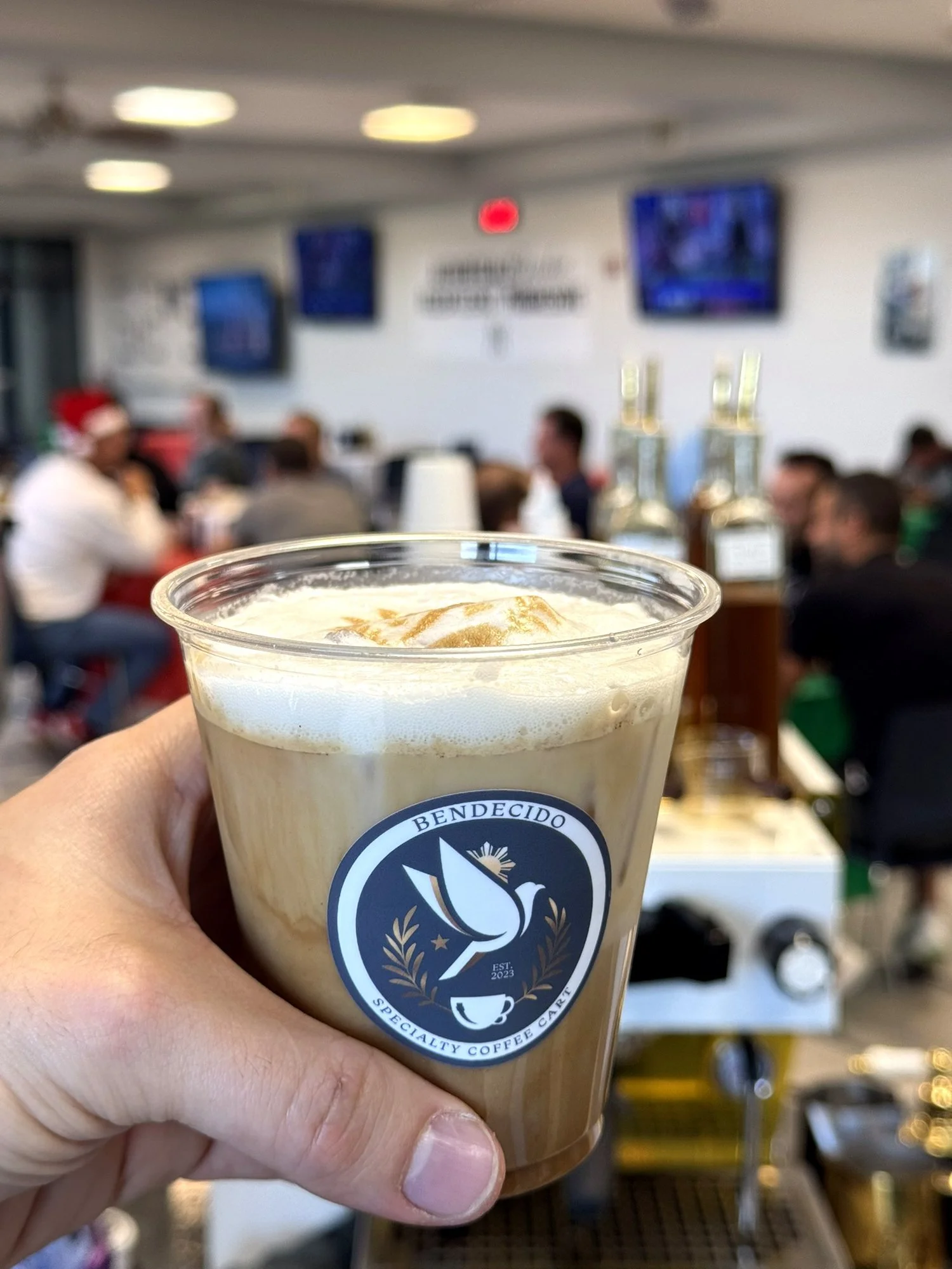 Iced latte in a Bendecido Coffee cup at a corporate event in Westshore, Tampa