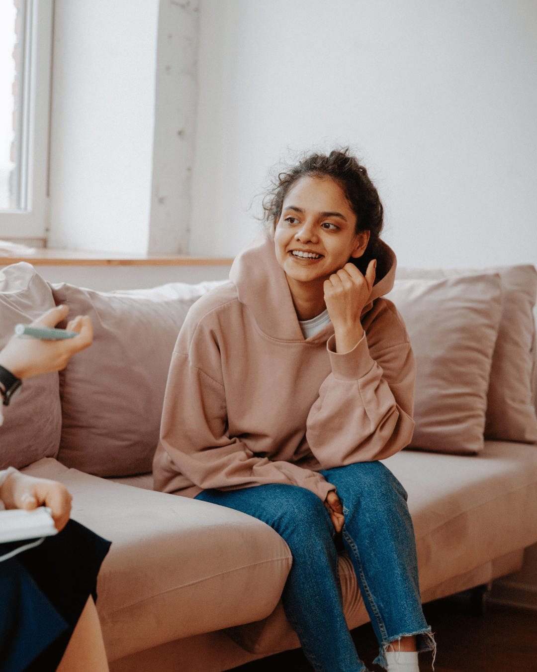 a young teenager talking to a counselor