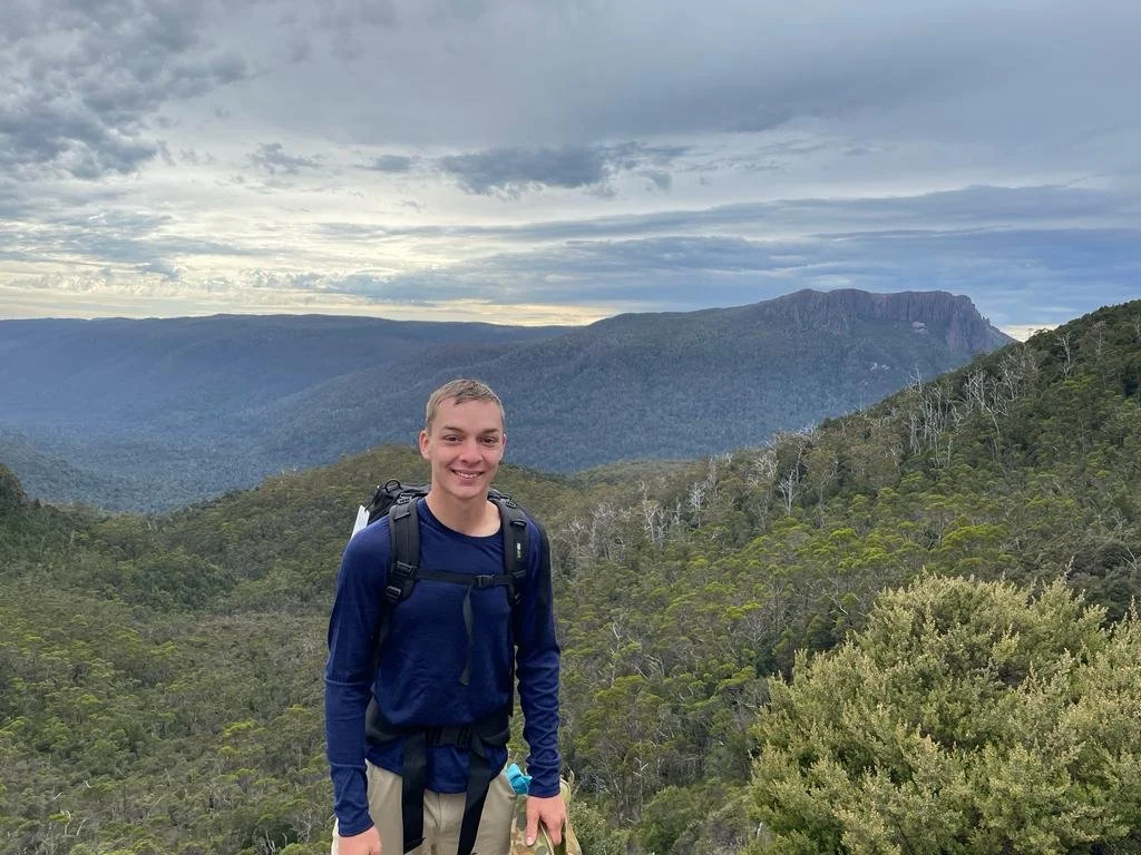 Young CEO of Total Plant Care company, pictured while out on vacation hiking in mountains.