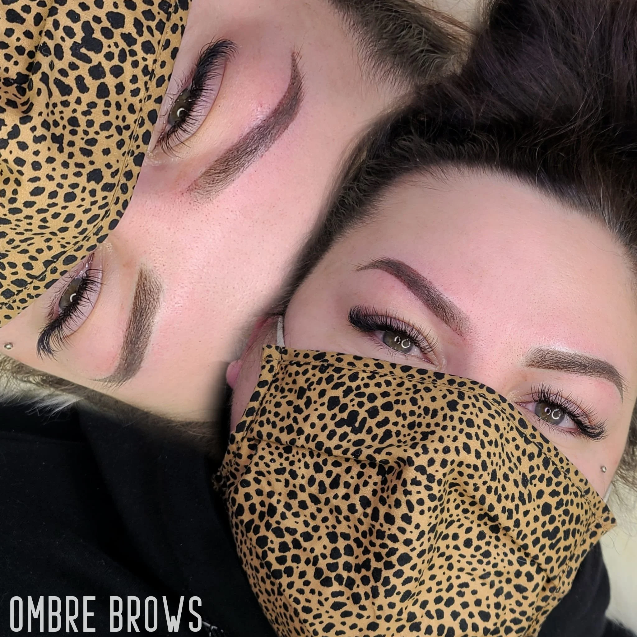 Two women with well-groomed eyebrows, one with natural makeup and the other with makeup, one wearing a leopard print face mask.