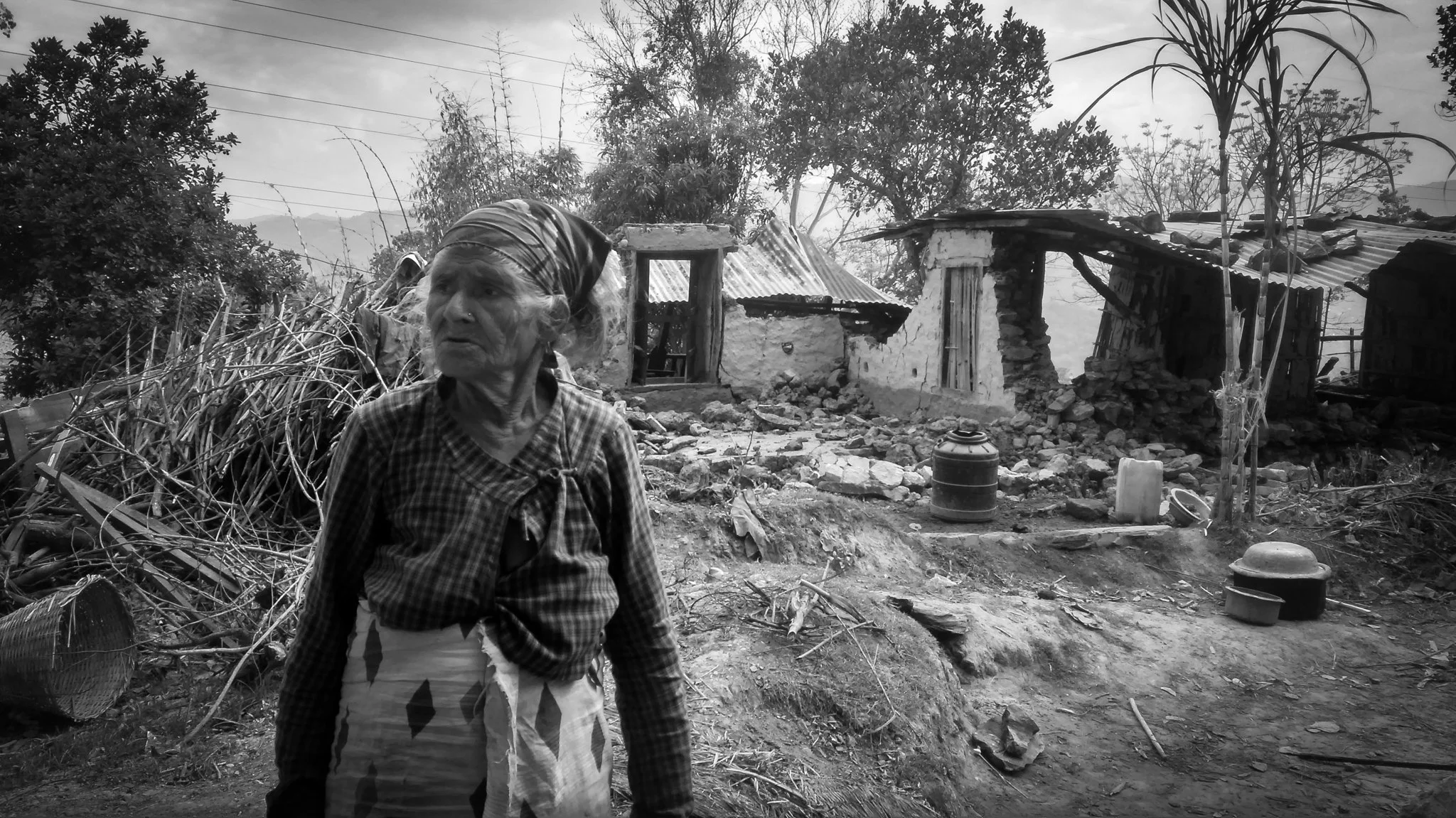 “What would you do now?” “We build it again.” – Survivor with Her Destroyed Home - 2015 Nepal Earthquake