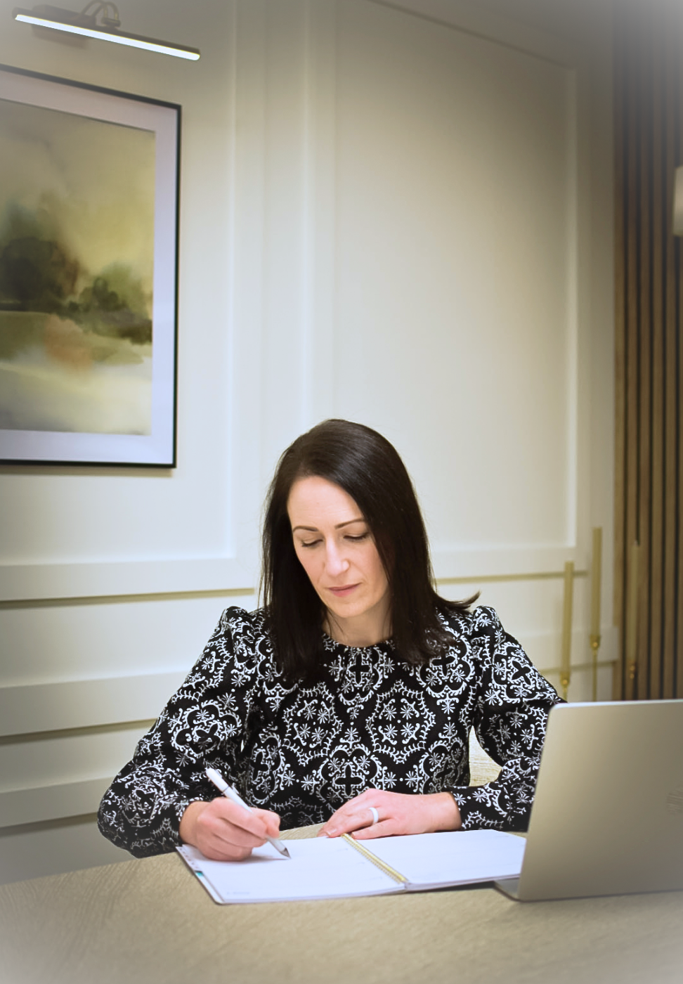 Women taking meeting notes