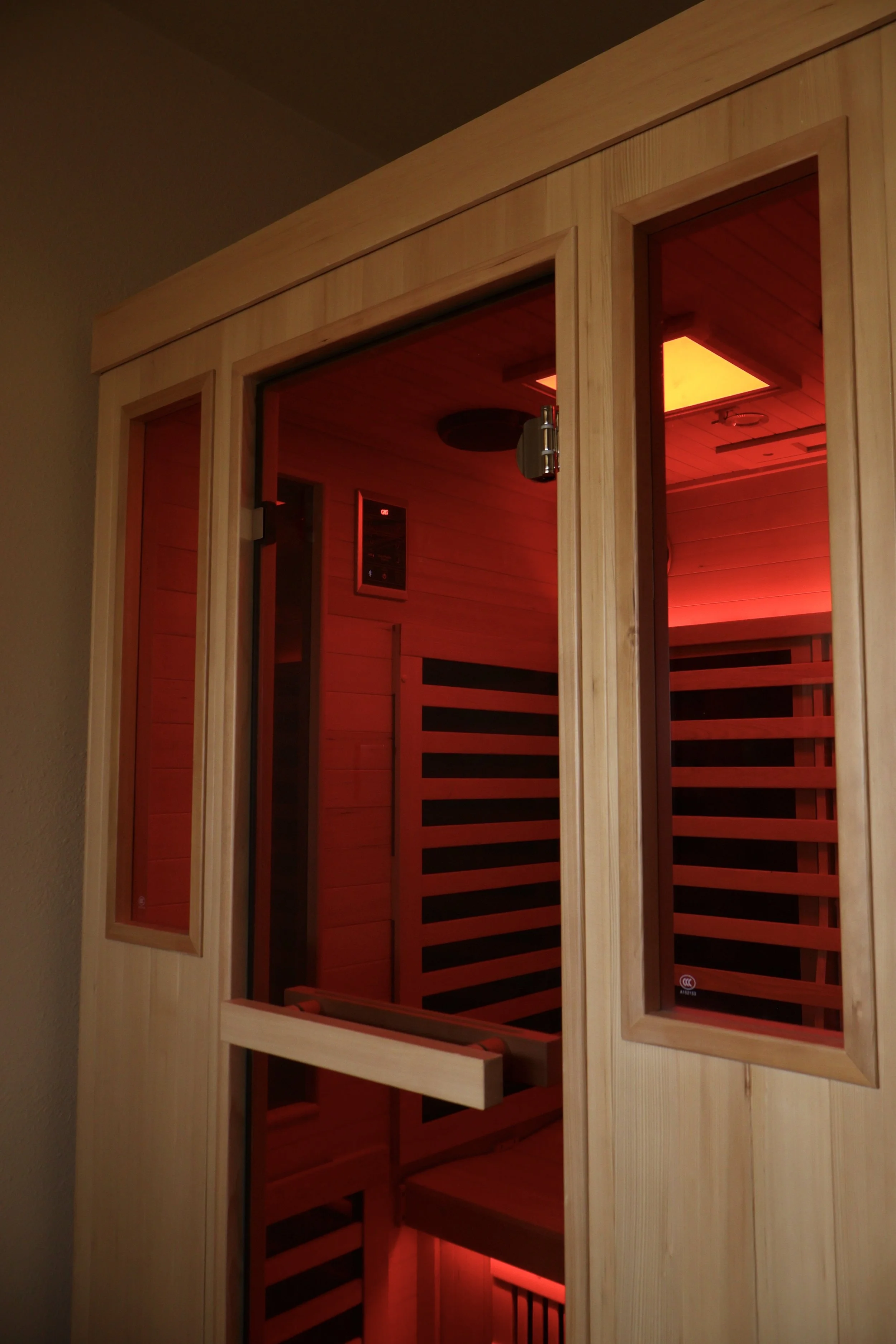 An infrared sauna with a red light inside