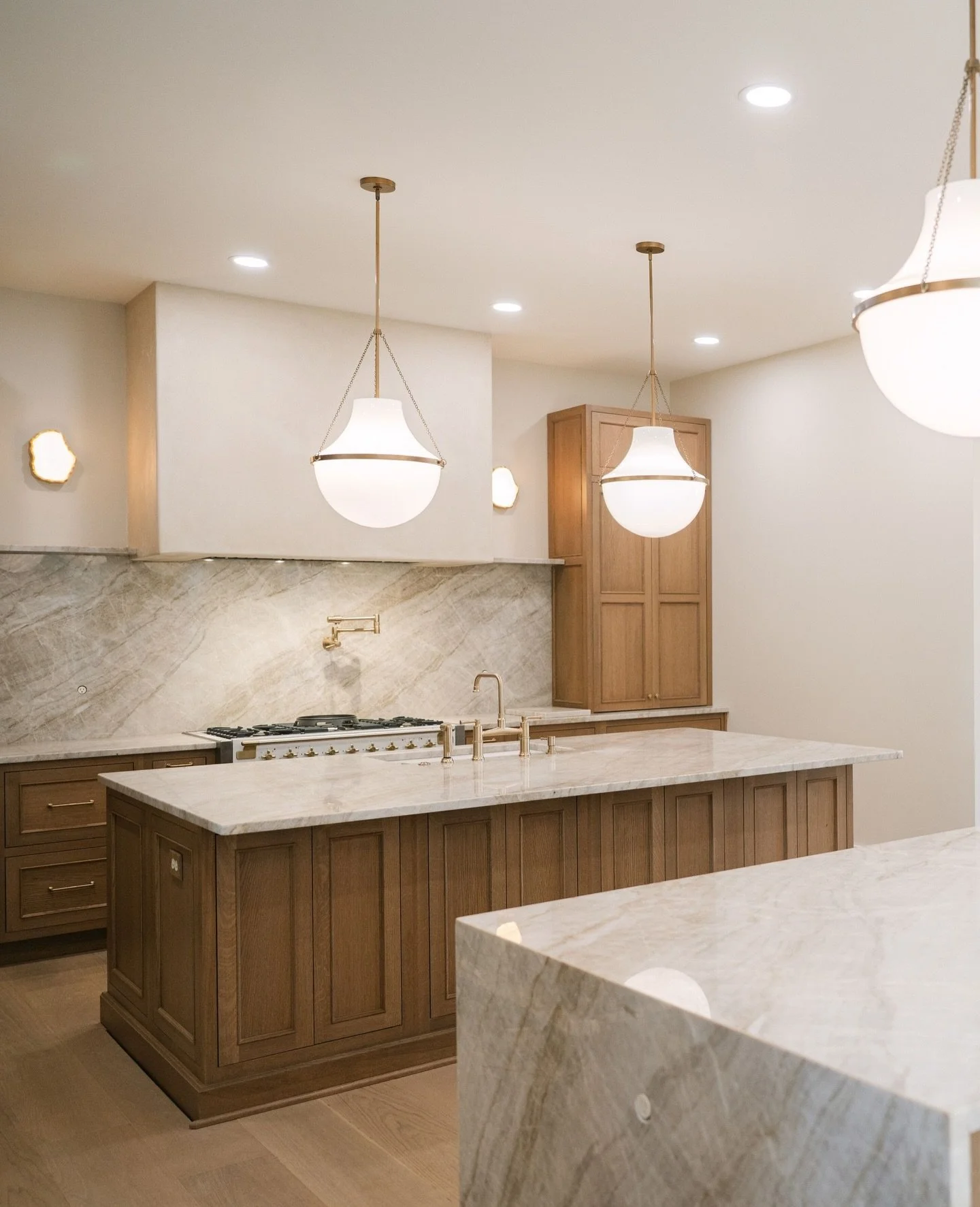 This kitchen is full of quiet luxuries: cabinetry that runs through both sides of the second island, soft-close custom drawers built for how you cook, and storage solutions that disappear into the design.⁠
⁠
Design that supports your life, not the ot